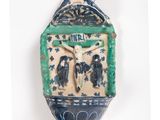 blue and white ceramic wall clock hanging on a white wall