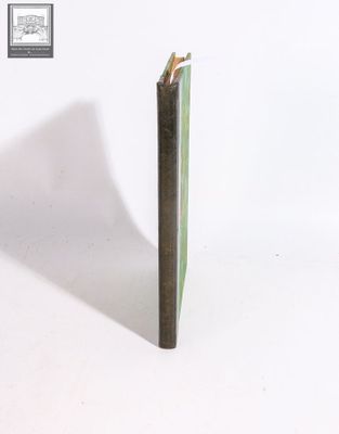 a pencil sticking out of a book on a white surface