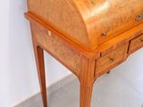 a small wooden desk with a drawer on it