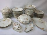 a lot of plates and bowls on the table