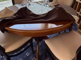 a table and chairs in a room with a large glass window
