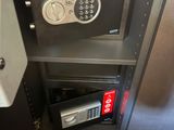 a safe box with a combination lock and a key on it