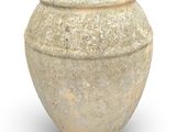 a large stone vase sitting on a white surface