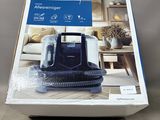 a close up of a box of a vacuum cleaner on a table