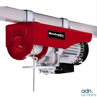 an image of a red electric hoist on a white background