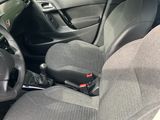 the interior of a car with the front seats folded down