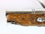 a close up of a knife on a white surface