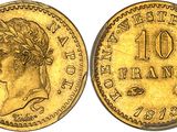 a gold coin with a woman ' s head and a crown on it