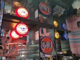 a bar with a lot of different signs on the wall
