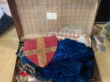 a suitcase with a heart and a cross inside of it
