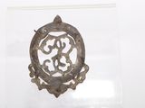 a picture of a metal object with a design on it