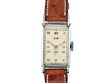 l'image d'une montre-bracelet avec un bracelet en cuir marron