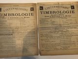 two pages of an old newspaper on a white table