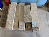 several pieces of wood are stacked on top of each other