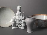 a small bowl and a small bowl sitting next to each other