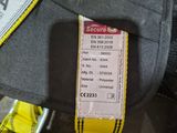 a seat belt with a tag attached to it