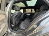 the interior of a car with the door open and the passenger seat down