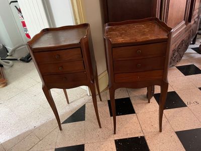 two wooden tables that are sitting on a checkered floor