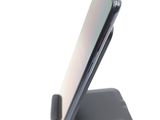 a close up of a cell phone on a stand