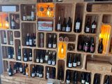 many bottles of wine on display in a wine shop