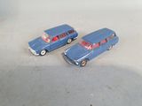 two toy cars that are sitting next to each other