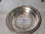a silver plate with spoons and spoons on a table