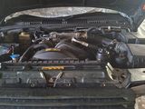 a picture of a car engine with its hood open