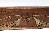 a wooden box that has a bird design on it