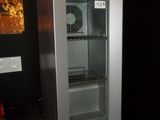 a small refrigerator that is sitting on top of a counter