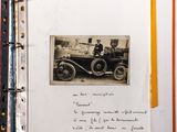 an old photo of a man and a woman sitting in a car