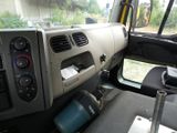 a view of the inside of a truck with the controls on