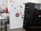 a refrigerator that is sitting in the middle of a room