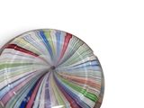 a picture of a colorful glass object on a white surface