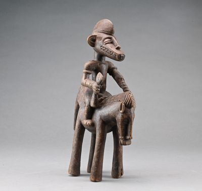 an image of a statue of a man sitting on top of a horse