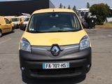 une camionnette jaune et noire garée sur un parking