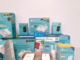many boxes of electronic gadgets sitting on a table