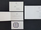a picture of a set of four cards on a table