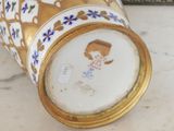 a vase that has a picture of a woman on it