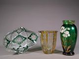 three vases sitting next to each other on a table