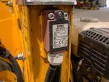 a close up of a machine with wires attached to the back of it