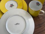 a plate and a cup sitting on a table