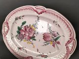 two plates and a bowl sitting on a table