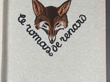 an open book with a picture of a fox on it