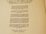 an open book with a picture of a cross on it