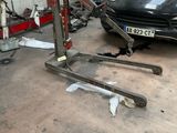 a picture of a car being worked on in a garage