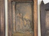 three wooden frames with a picture of a castle on them