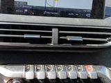 the dashboard of a car with a gps device on the dashboard