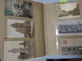 a person holding a book with pictures on it