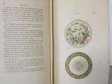 an open book with a picture of a plate on it