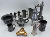 many different types of coffee pots and cups on the table